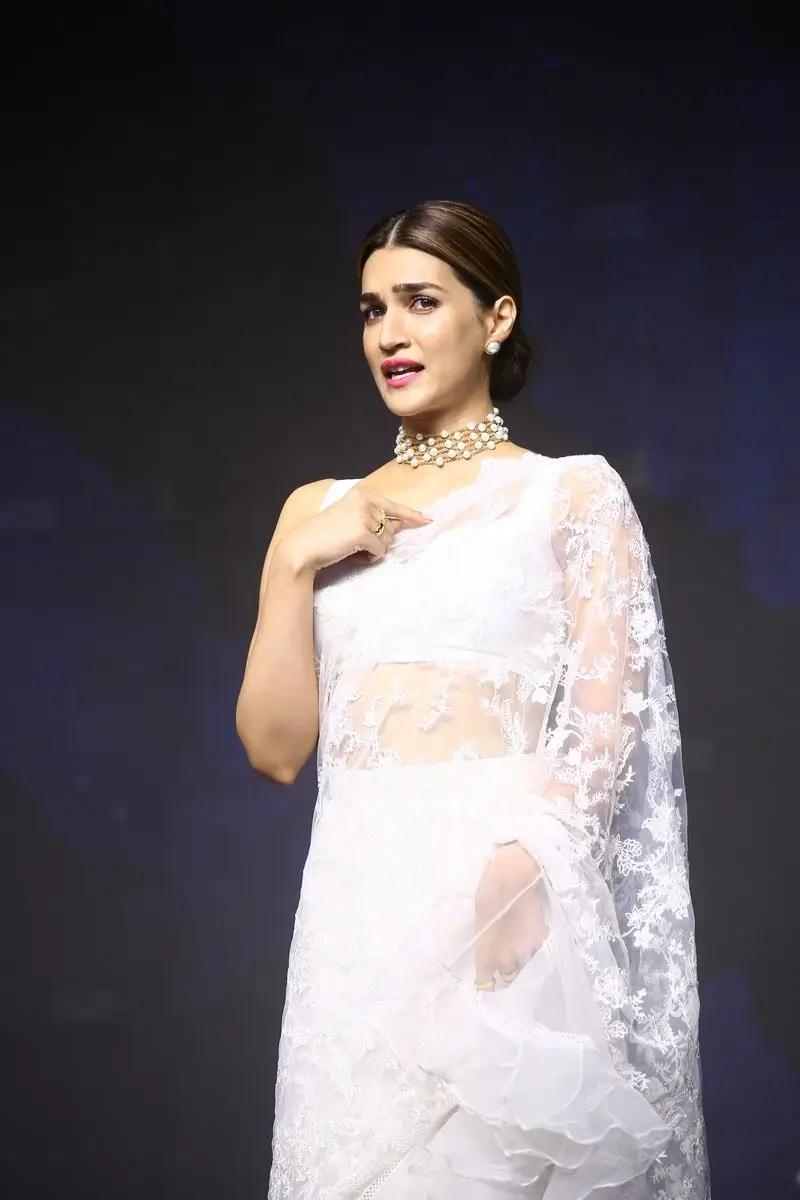 Kriti Sanon Charming Stills In White Saree Sleeveless Blouse